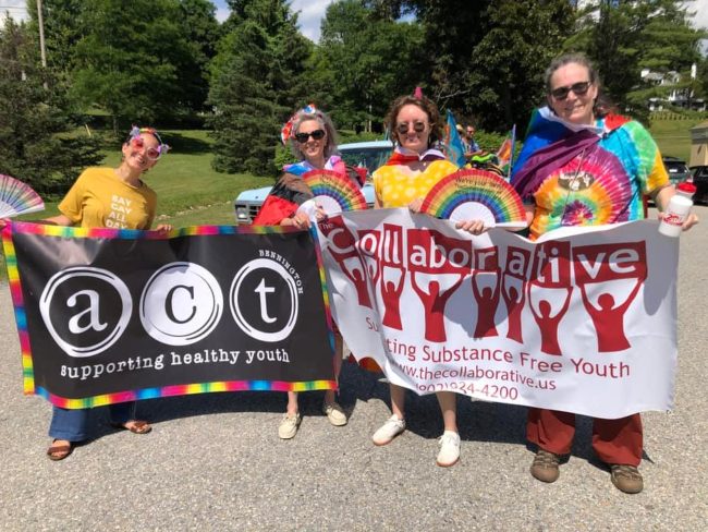 The Collaborative's staff carrying banners for the Pride parade